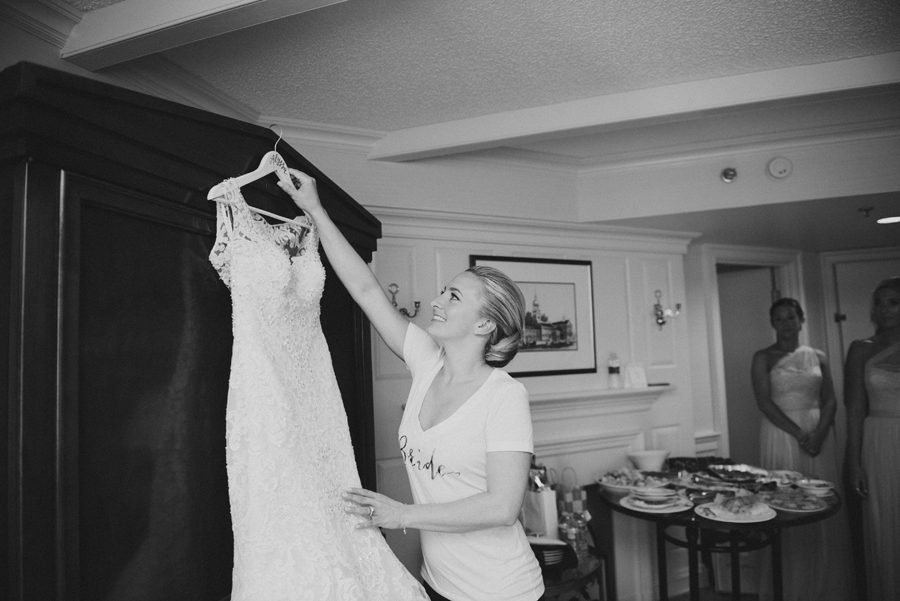 bride reaching for her dress