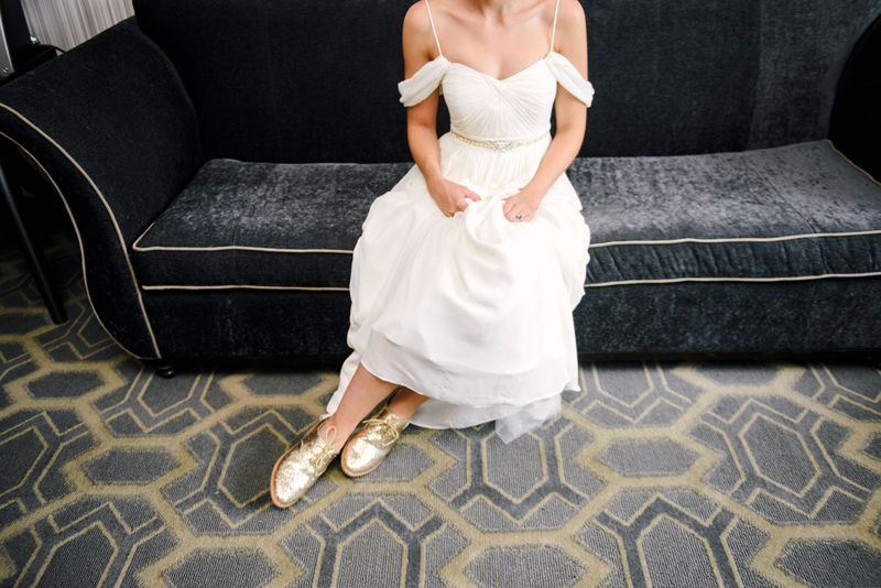 sitting with gold glitter oxford shoes