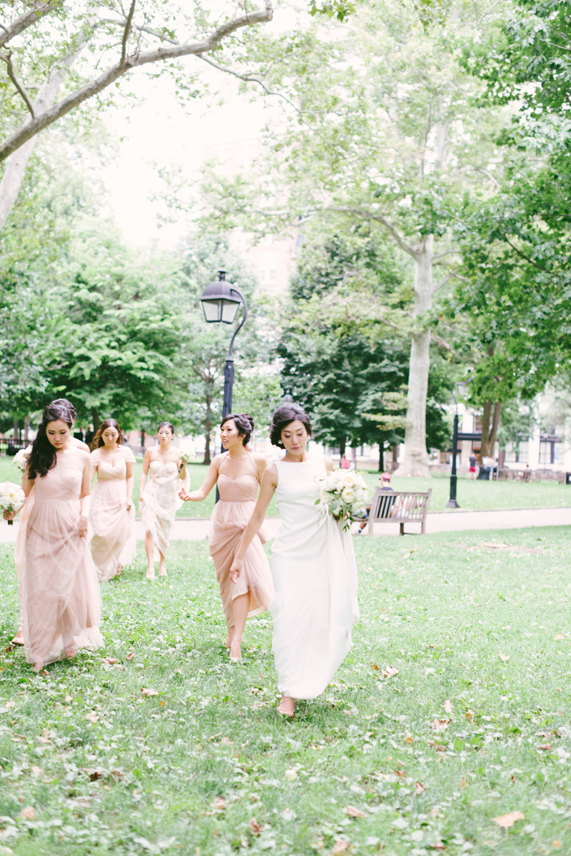 candid of bride walking with bridesmaids