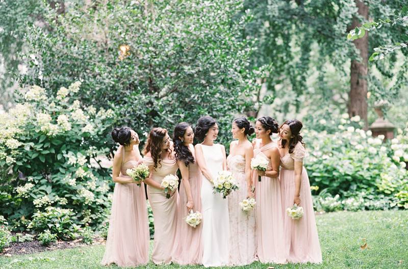 contax 645 image of bride laughing with her bridesmaids at park