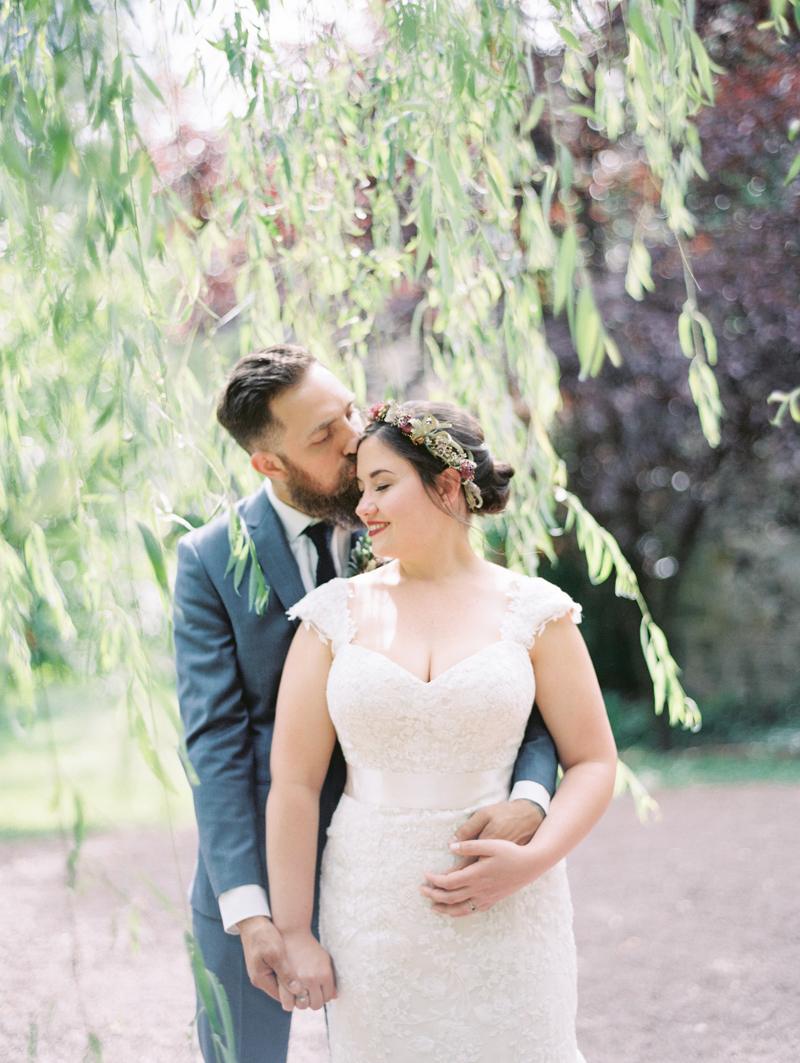 Bride and Groom by a willow tree at Hollyhedge Estate wedding
