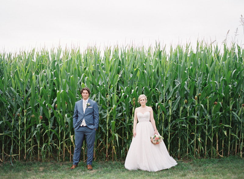 bride and groom in front of corn field at Brandywine Manor House wedding