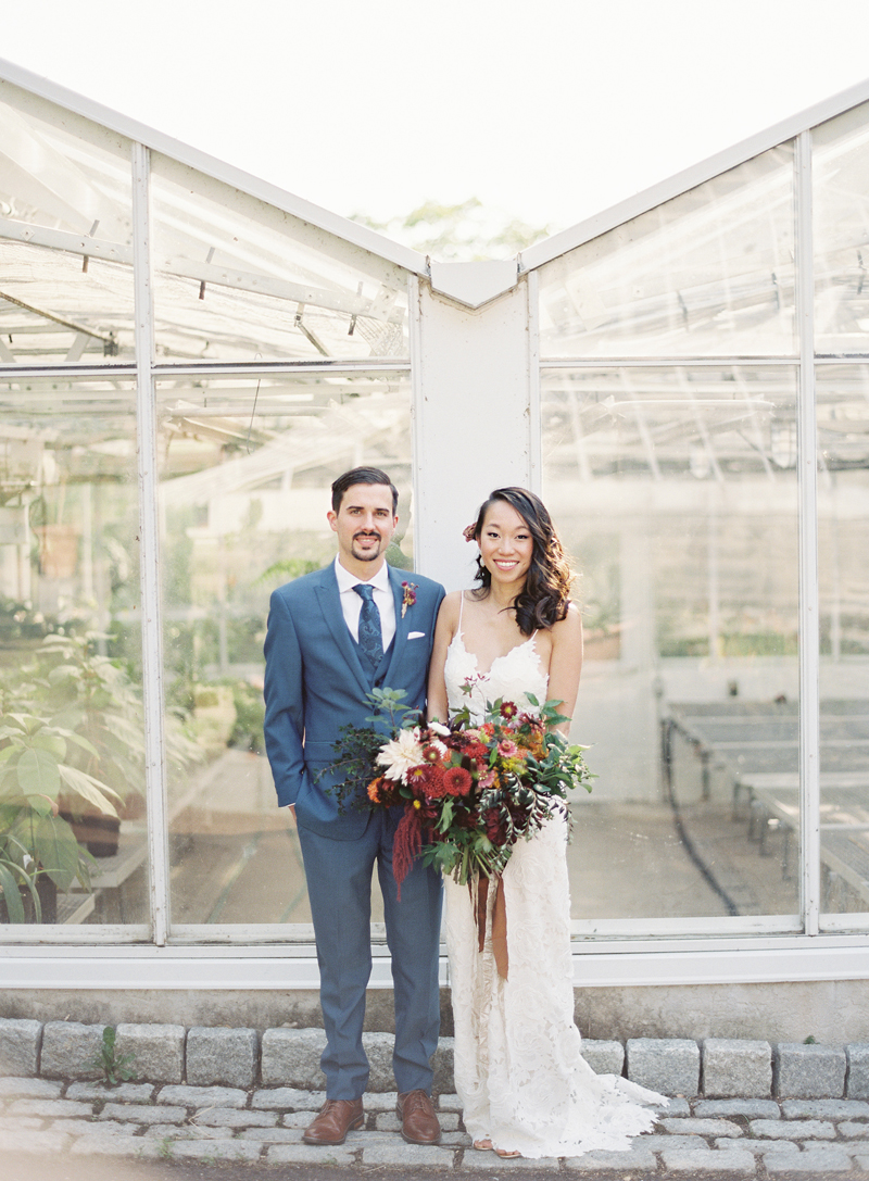 Morris Arboretum wedding photo of bride and groom in front of greenhouse 