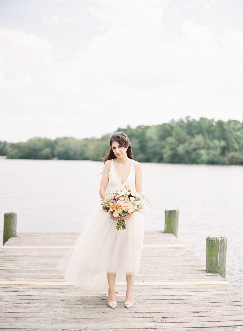 bride on dock at private estate wedding, film image